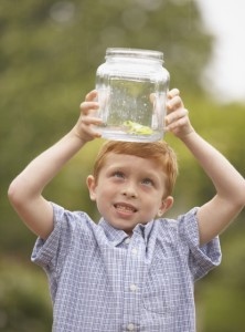 boy observing frog